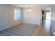 Bright dining room with carpeted floor and view to kitchen at 36285 N Mirandesa Dr, San Tan Valley, AZ 85143