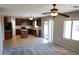 Kitchen with island, dark wood cabinets, and tile flooring at 36285 N Mirandesa Dr, San Tan Valley, AZ 85143