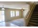 Spacious living room with carpet, ceiling fan and stairs at 36285 N Mirandesa Dr, San Tan Valley, AZ 85143