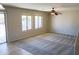 Bright living room with carpeted floor and ceiling fan at 36285 N Mirandesa Dr, San Tan Valley, AZ 85143