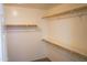 Walk-in closet with double hanging rods and shelving at 36285 N Mirandesa Dr, San Tan Valley, AZ 85143