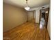 Bright bedroom with wood-look floors and mirrored closet at 431 W Knox Rd, Chandler, AZ 85225