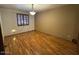 Spacious bedroom featuring wood-look floors and window with shutters at 431 W Knox Rd, Chandler, AZ 85225