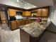 Kitchen boasts granite counters and oak cabinets at 431 W Knox Rd, Chandler, AZ 85225