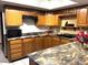 Kitchen with granite counters and oak cabinets at 431 W Knox Rd, Chandler, AZ 85225