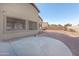 Spacious backyard with a concrete patio at 43102 W Venture Rd, Maricopa, AZ 85138