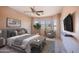 Main bedroom with a ceiling fan and plenty of natural light at 43102 W Venture Rd, Maricopa, AZ 85138