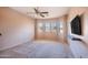 Bedroom with bay window and ceiling fan at 43102 W Venture Rd, Maricopa, AZ 85138