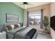 Guest bedroom with large window and ceiling fan at 43102 W Venture Rd, Maricopa, AZ 85138