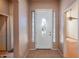 Inviting entryway with tile flooring and a white door at 43102 W Venture Rd, Maricopa, AZ 85138