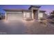 House exterior featuring a neutral color scheme and attached garage at 43102 W Venture Rd, Maricopa, AZ 85138