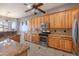 Spacious kitchen with granite countertops and stainless steel appliances at 43102 W Venture Rd, Maricopa, AZ 85138