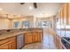 Bright kitchen with granite countertops and an island at 43102 W Venture Rd, Maricopa, AZ 85138