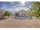 Large backyard with gravel and a patio at 4710 E Torrey Pines Ln, Chandler, AZ 85249