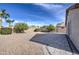 Landscaped backyard with paved patio and gravel at 4710 E Torrey Pines Ln, Chandler, AZ 85249