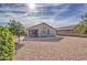 Large backyard with gravel and a patio at 4710 E Torrey Pines Ln, Chandler, AZ 85249