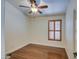 Light and airy bedroom with wood floors and plantation shutters at 4710 E Torrey Pines Ln, Chandler, AZ 85249