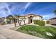 House exterior with a landscaped yard and two palm trees at 4710 E Torrey Pines Ln, Chandler, AZ 85249