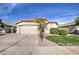 Front view of a house with a palm tree and well-kept lawn at 4710 E Torrey Pines Ln, Chandler, AZ 85249