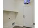 Laundry room with built-in shelving and exterior access at 4710 E Torrey Pines Ln, Chandler, AZ 85249