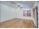 Bright and airy living room features hardwood floors and plantation shutters at 4710 E Torrey Pines Ln, Chandler, AZ 85249