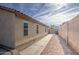 Side yard with concrete pathway, gravel, and gated access at 4710 E Torrey Pines Ln, Chandler, AZ 85249