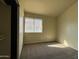 Bedroom with carpet flooring and large window at 4730 W Rose Ln, Glendale, AZ 85301