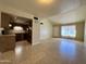 Open concept kitchen and living area with tile floors at 4730 W Rose Ln, Glendale, AZ 85301