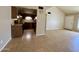 Open concept kitchen and living area with tile floors at 4730 W Rose Ln, Glendale, AZ 85301