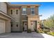 Front view of a two-story townhome with stone accents and a welcoming entryway at 5100 E Rancho Paloma Pkwy # 1014, Cave Creek, AZ 85331