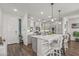 Modern kitchen featuring white shaker cabinets, quartz countertops, and an island at 5100 E Rancho Paloma Pkwy # 1014, Cave Creek, AZ 85331