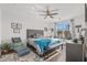 Main bedroom with wood floors, a ceiling fan, and a large window at 5100 E Rancho Paloma Pkwy # 1014, Cave Creek, AZ 85331