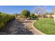 Landscaped backyard with artificial turf and desert landscaping at 5352 N Gila Trail Dr, Eloy, AZ 85131