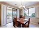 Bright dining area with wood table and access to backyard patio at 5352 N Gila Trail Dr, Eloy, AZ 85131