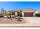 Single-story home with brown garage door and desert landscaping at 5352 N Gila Trail Dr, Eloy, AZ 85131