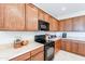 Kitchen with wood cabinets, stainless steel appliances and granite countertops at 5352 N Gila Trail Dr, Eloy, AZ 85131