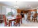 Kitchen with breakfast nook, island, and wood cabinets at 5352 N Gila Trail Dr, Eloy, AZ 85131