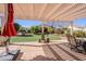 Covered patio with artificial turf and seating at 5352 N Gila Trail Dr, Eloy, AZ 85131