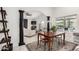 Charming dining area with a wooden table and chairs, adjacent to the living room at 5402 E Paradise Ln, Scottsdale, AZ 85254