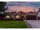 Beautiful stucco home with a 2 car garage, mature landscaping, and a welcoming front porch at 5402 E Paradise Ln, Scottsdale, AZ 85254