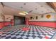 Garage with retro-themed floor and storage cabinets at 5402 E Paradise Ln, Scottsdale, AZ 85254