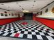 Stylish garage with checkered floor and Route 66 decor at 5402 E Paradise Ln, Scottsdale, AZ 85254