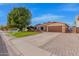 Front view of a charming house with a well-maintained lawn at 5402 E Paradise Ln, Scottsdale, AZ 85254