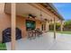 Covered patio with seating area, grill, and ceiling fans at 5402 E Paradise Ln, Scottsdale, AZ 85254