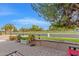 Relaxing patio with park view, brick pavers, and potted plants at 5402 E Paradise Ln, Scottsdale, AZ 85254