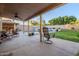 Covered patio with pool and grassy backyard at 5432 E Grandview Rd, Scottsdale, AZ 85254