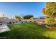 Expansive backyard with grassy lawn and swimming pool at 5432 E Grandview Rd, Scottsdale, AZ 85254