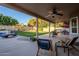 Covered patio overlooks a spacious backyard with a pool at 5432 E Grandview Rd, Scottsdale, AZ 85254