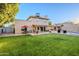 Green grassy backyard with patio and pool in view at 5432 E Grandview Rd, Scottsdale, AZ 85254