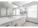 Elegant bathroom boasts double vanity and a large mirror at 5432 E Grandview Rd, Scottsdale, AZ 85254